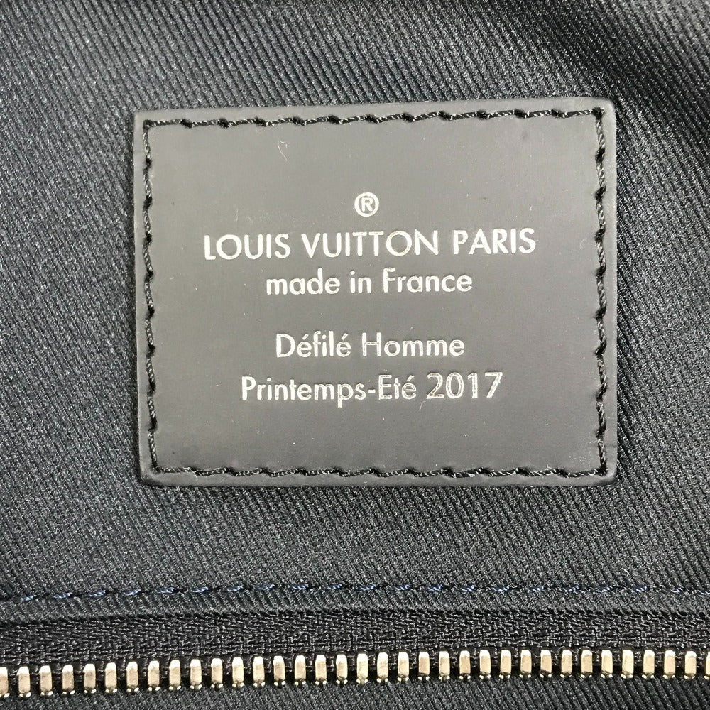 Louis Vuitton label on a gray fabric background