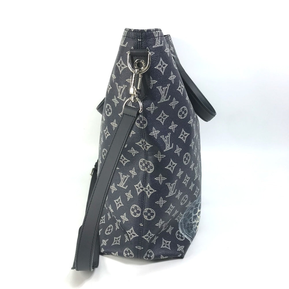 Designer handbag with monogram pattern on a white background
