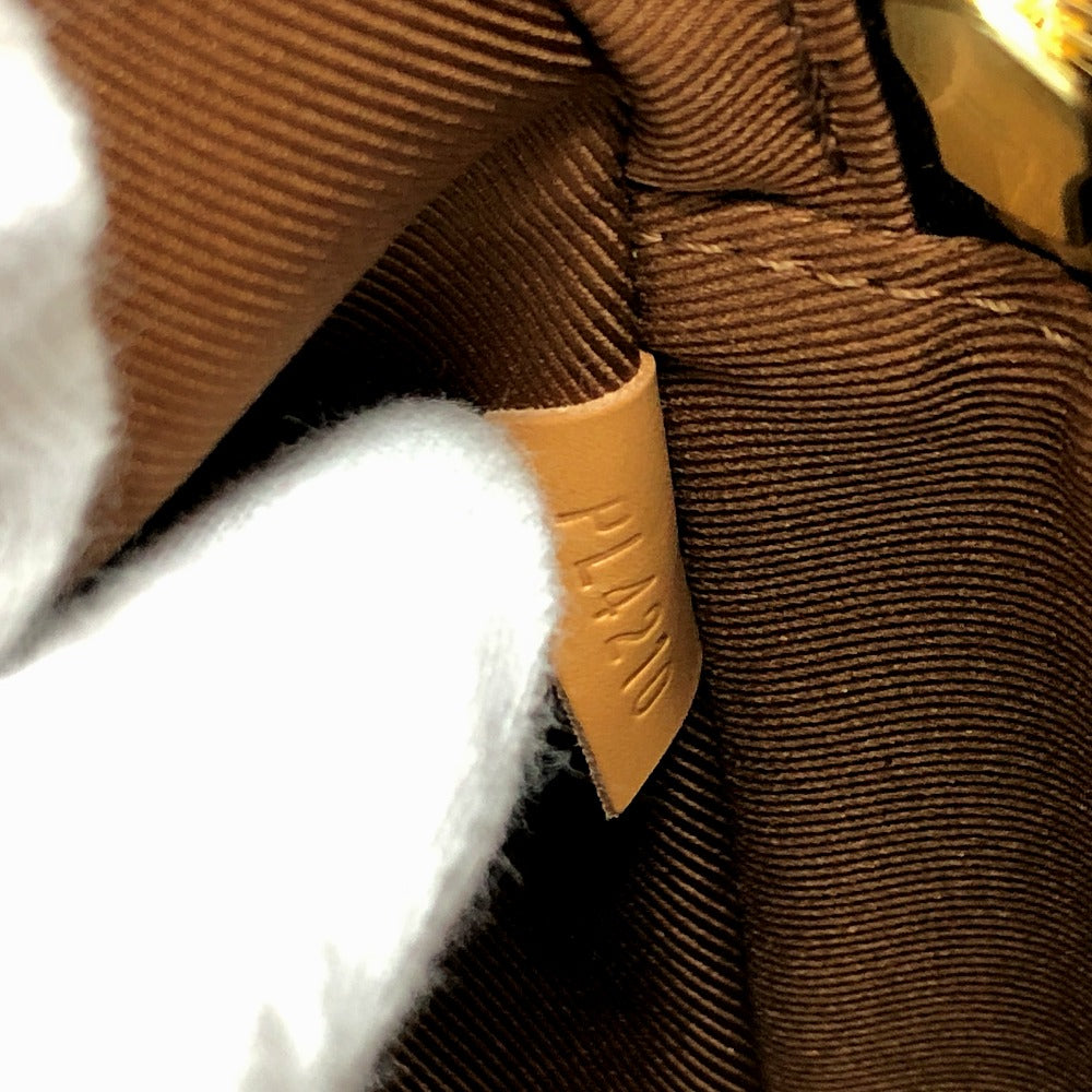 Close-up of brown textured fabric with a yellow tag.