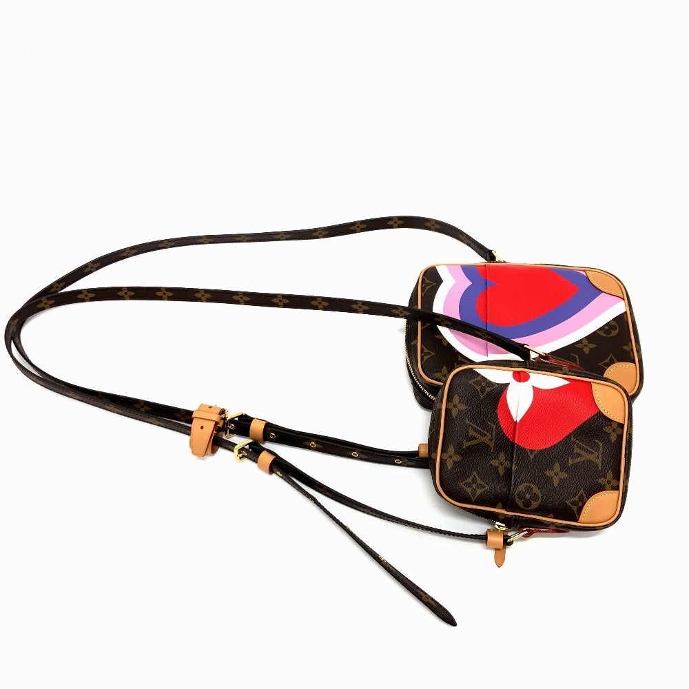 Designer handbag with a colorful abstract design on a white background