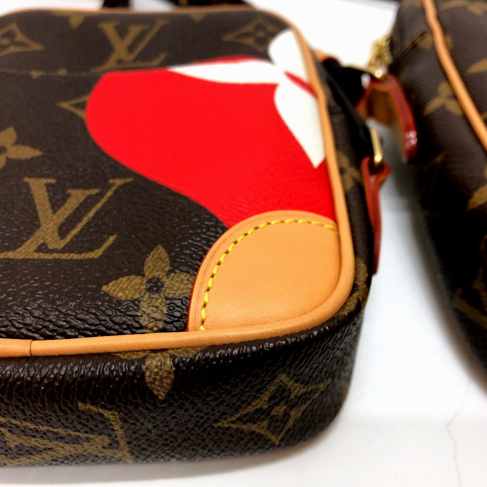 Louis Vuitton monogram bag with a red heart design on a white background