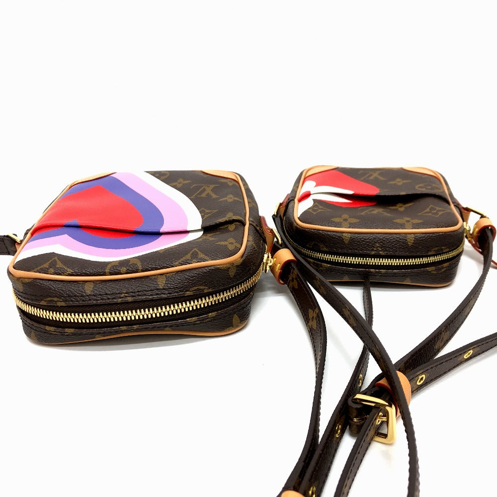 Two handbags with colorful abstract designs on a white background