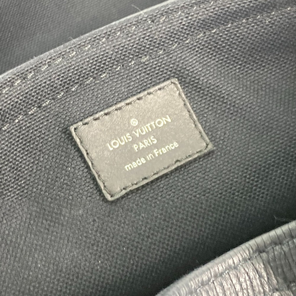 Louis Vuitton label on a dark fabric surface