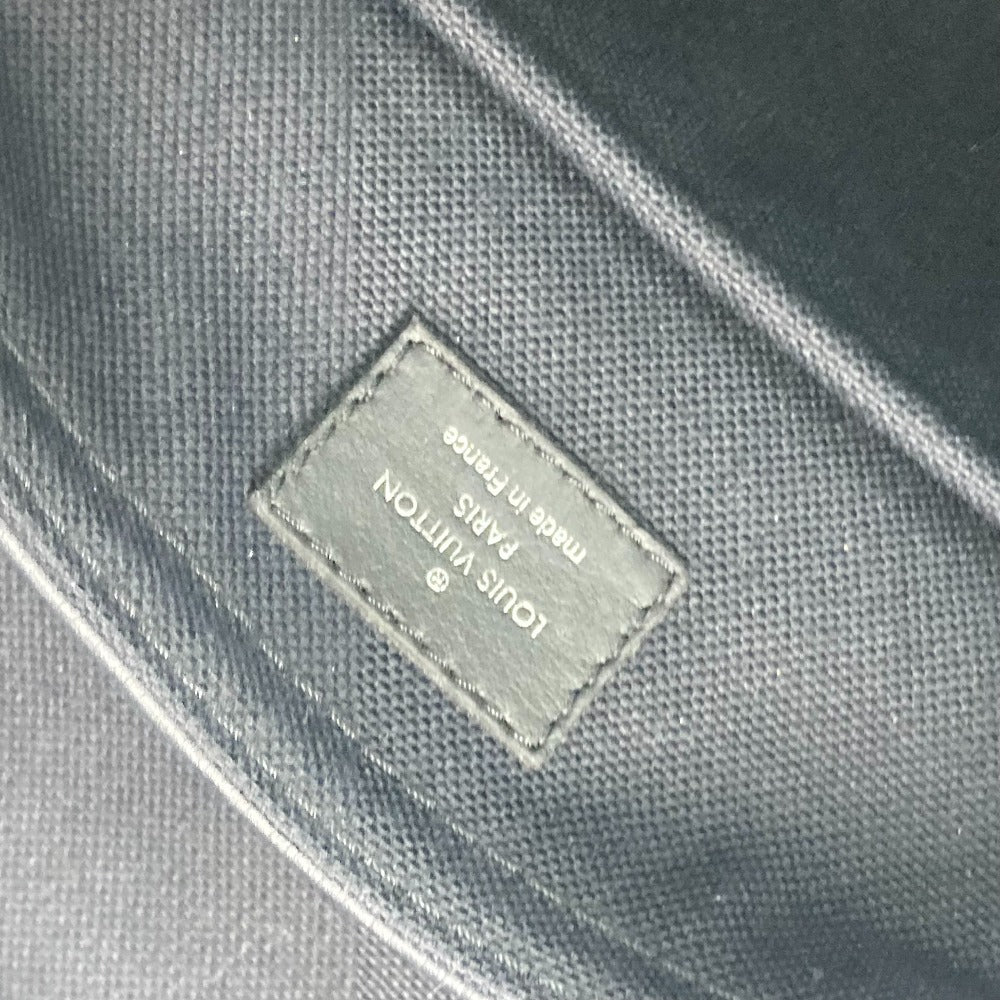 Louis Vuitton label on a dark fabric surface