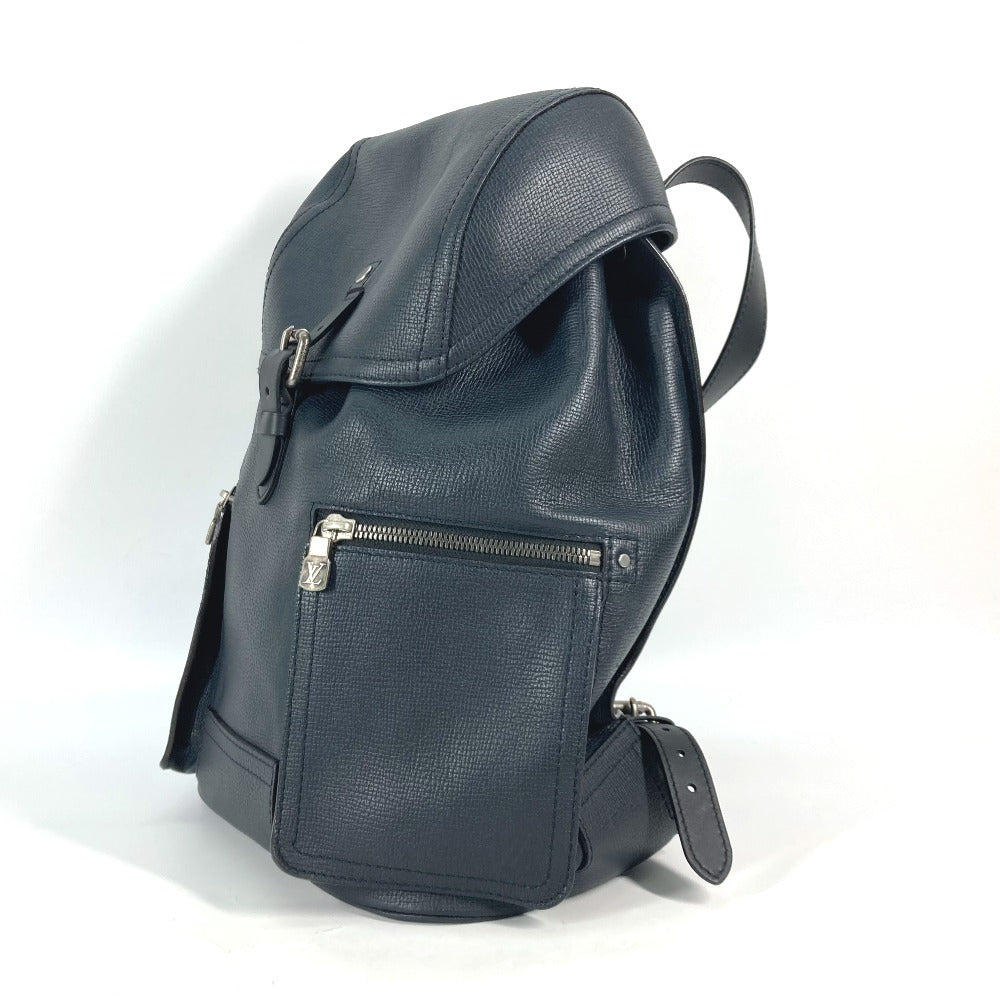 Blue leather backpack on a white background