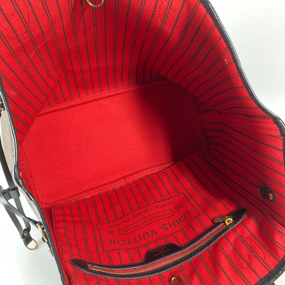 Red Louis Vuitton handbag with visible branding on a white background