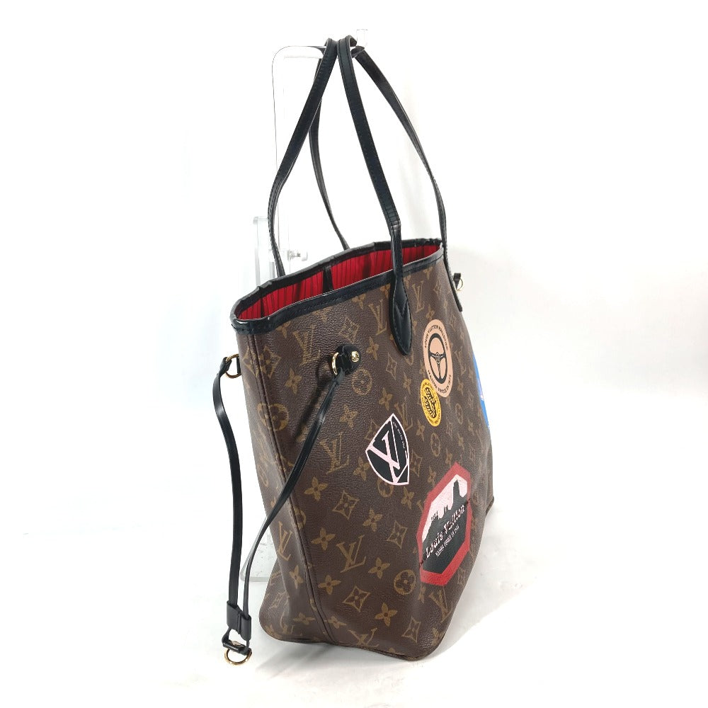 Designer handbag with patches on a white background