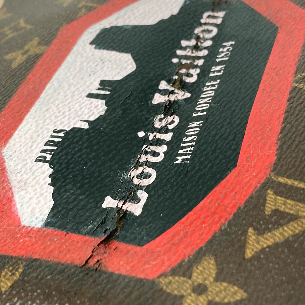 Close-up of a Louis Vuitton logo on a textured surface