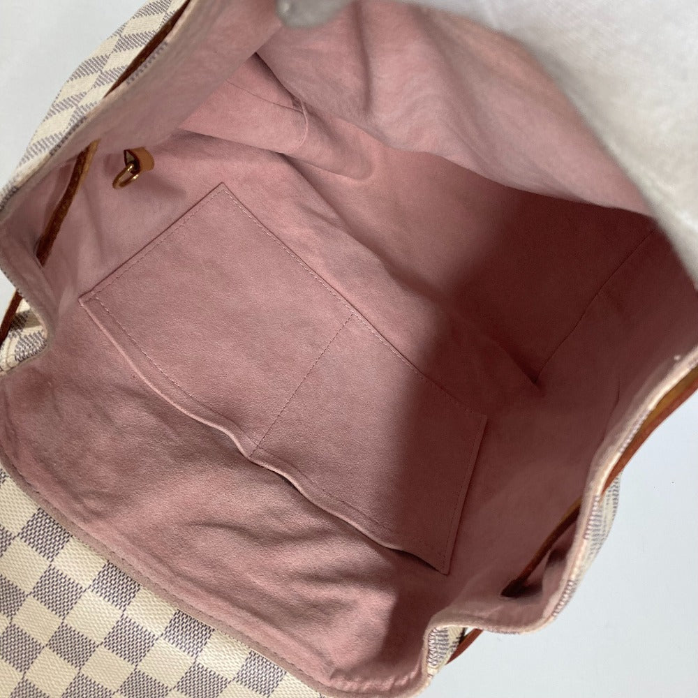 Pink fabric inside a checkered bag