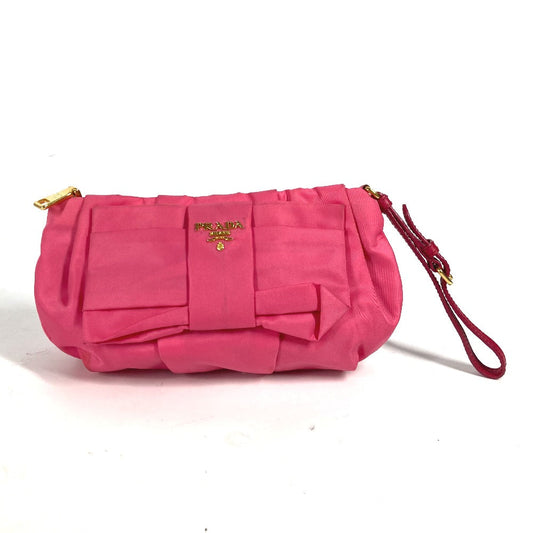 Pink handbag with a bow on a white background