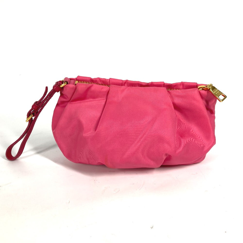 Pink handbag with gold zipper on a white background