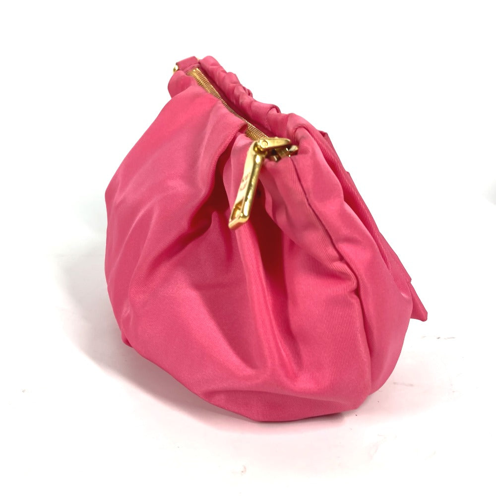 Pink handbag with a gold zipper on a white background