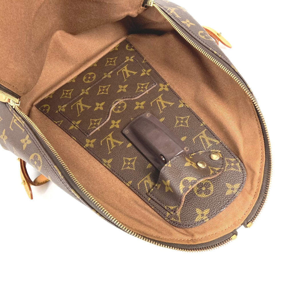 Brown leather bag with gold monogram pattern on a white background