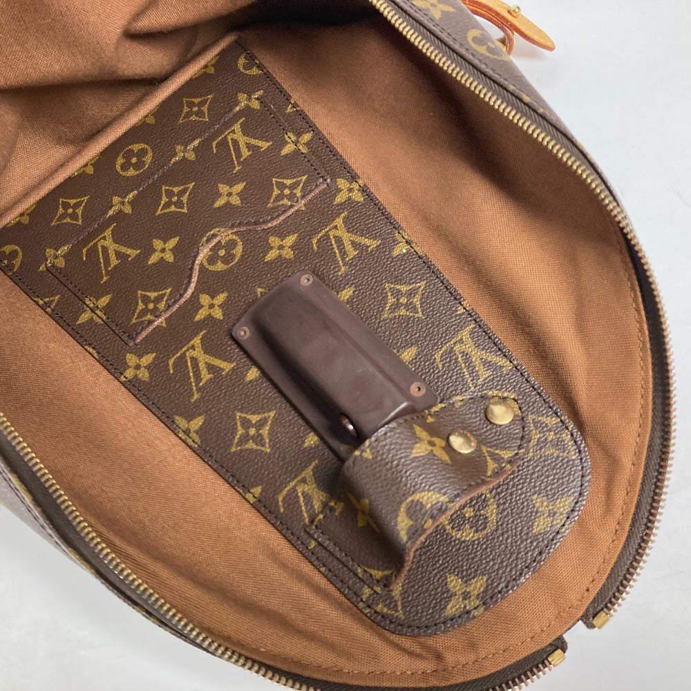 Brown leather bag with gold monogram pattern on a white background