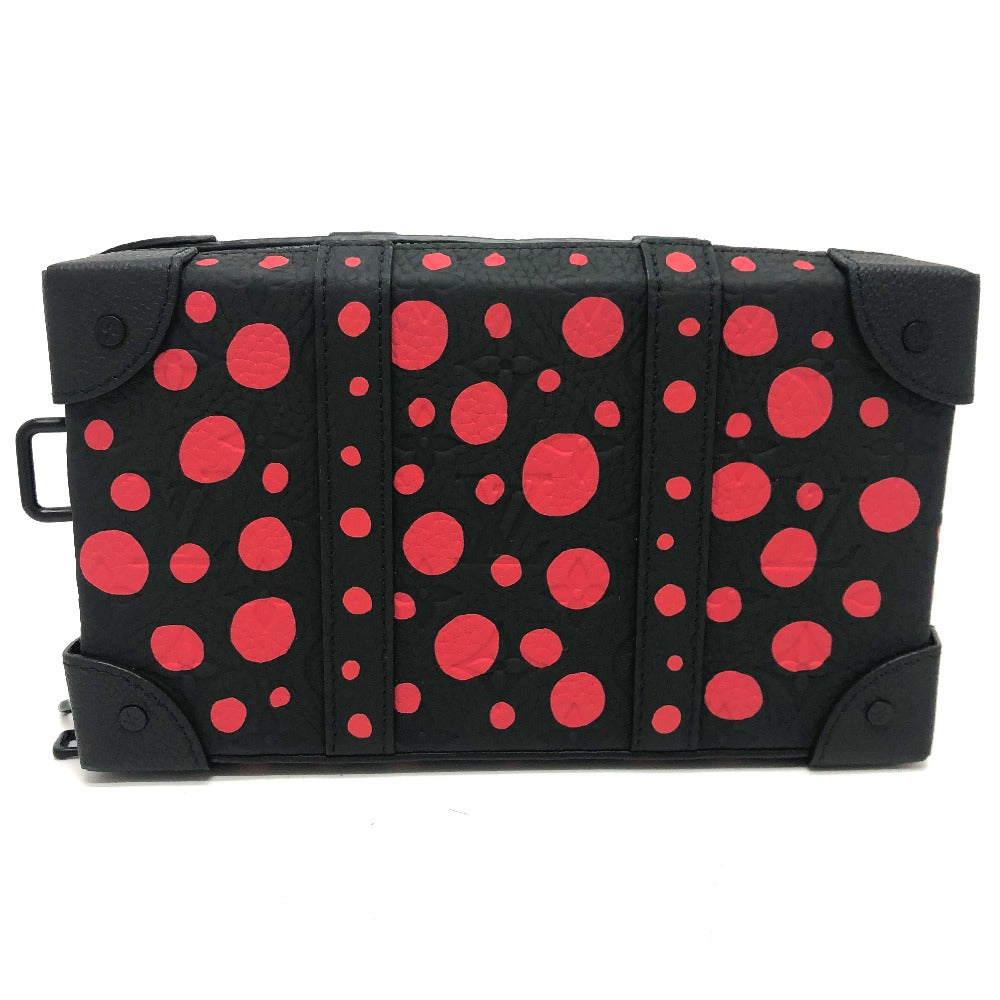Black bag with red polka dot pattern on a white background