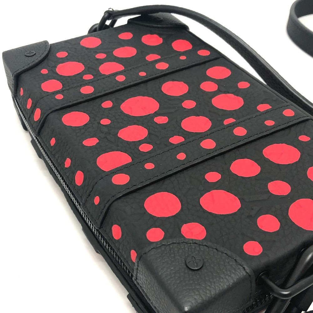 Black bag with red polka dot pattern on a white background