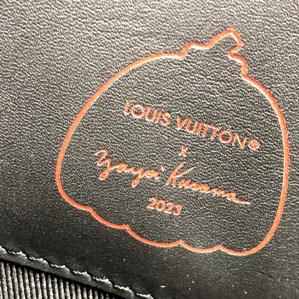 Louis Vuitton x Yayoi Kusama collaboration logo on a black leather surface
