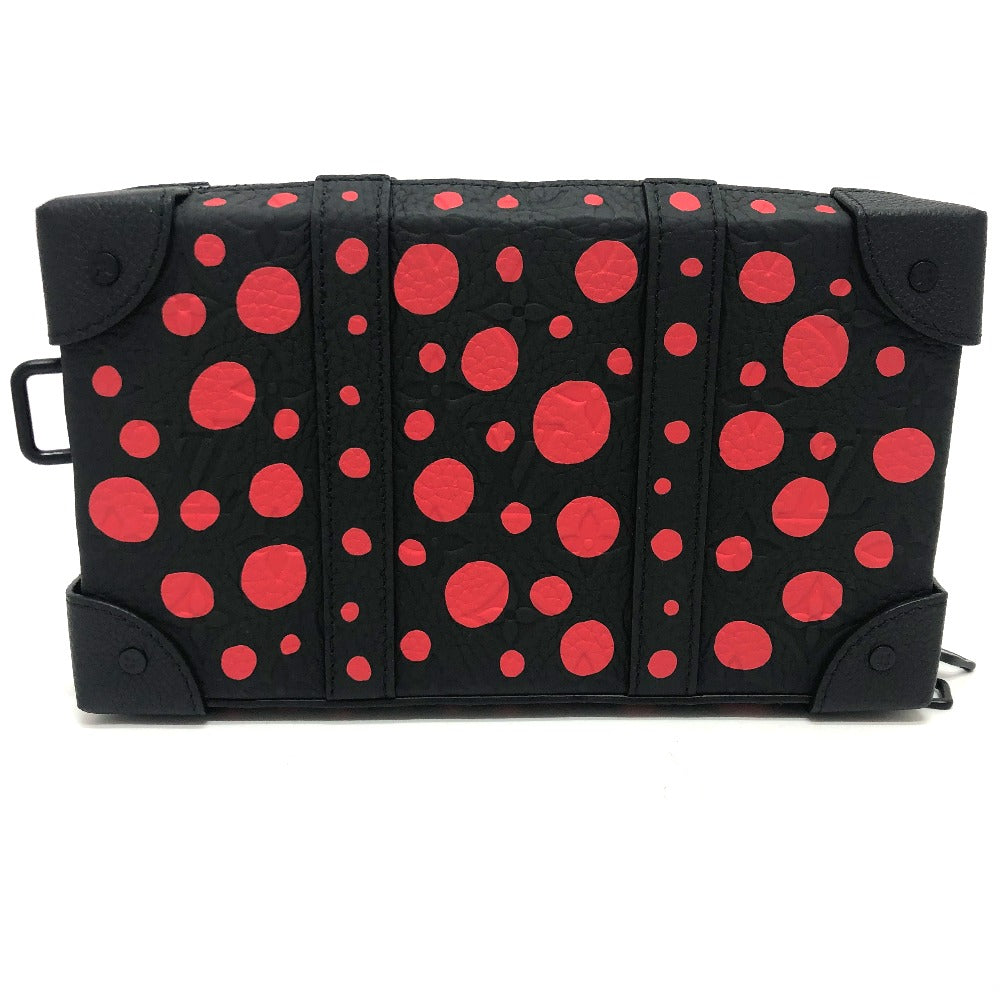 Black bag with red polka dots on a white background