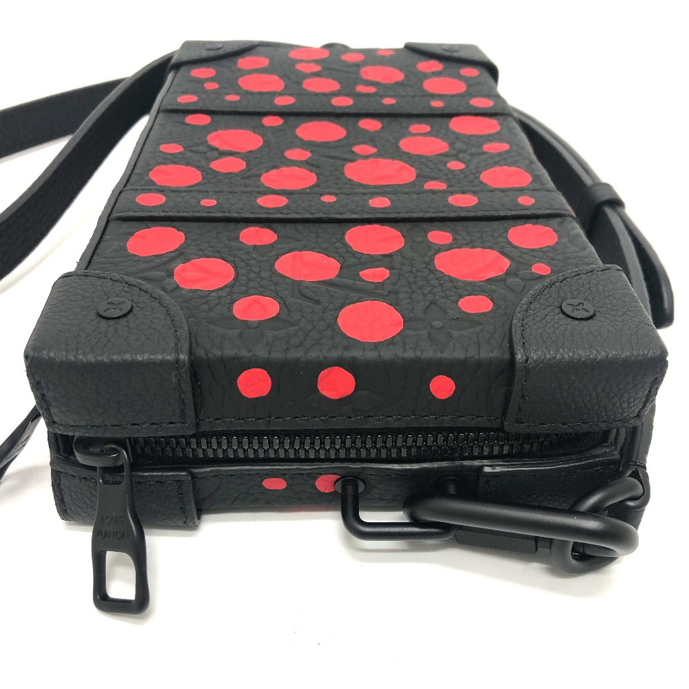 Black bag with red polka dot pattern on a white background