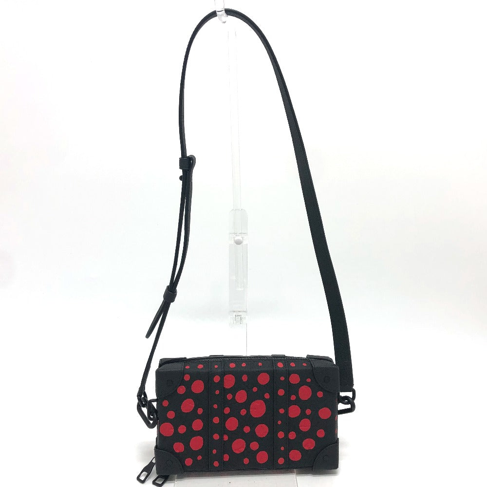Black bag with red polka dots on a white background