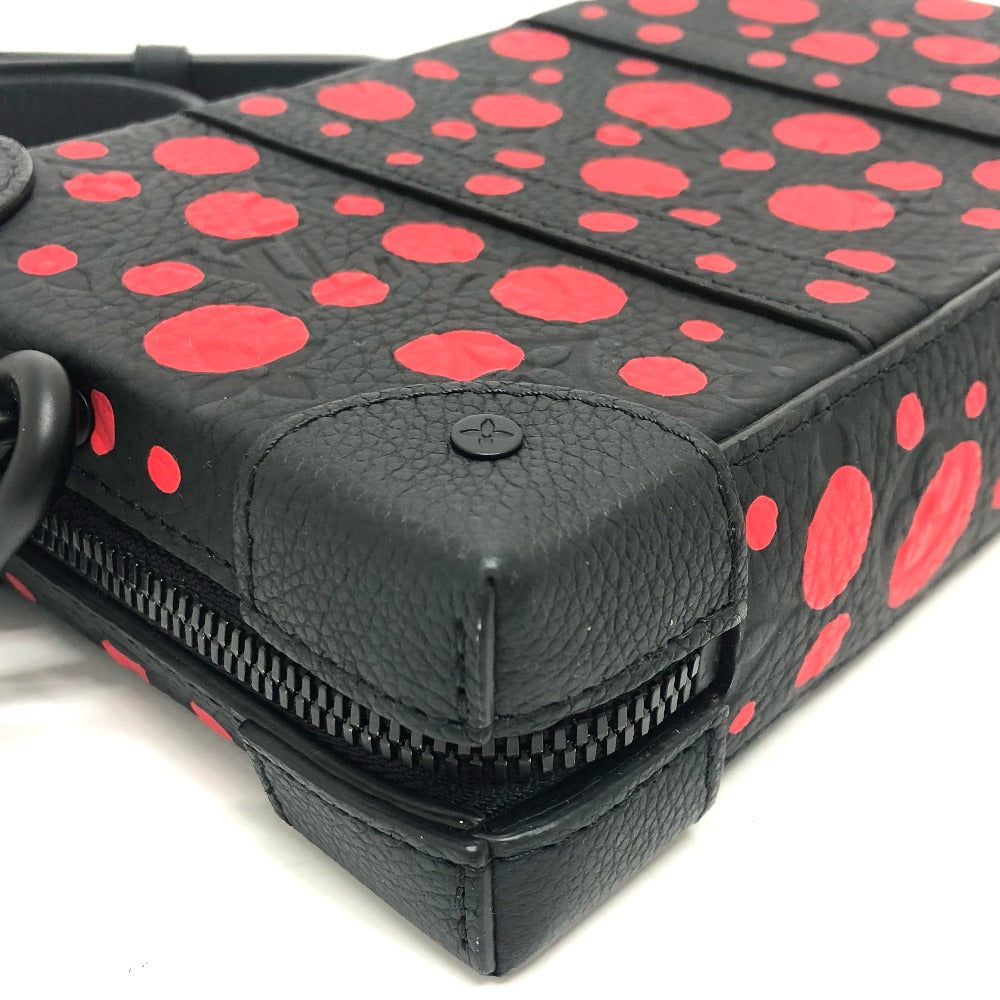 Black wallet with red polka dot pattern on a white background
