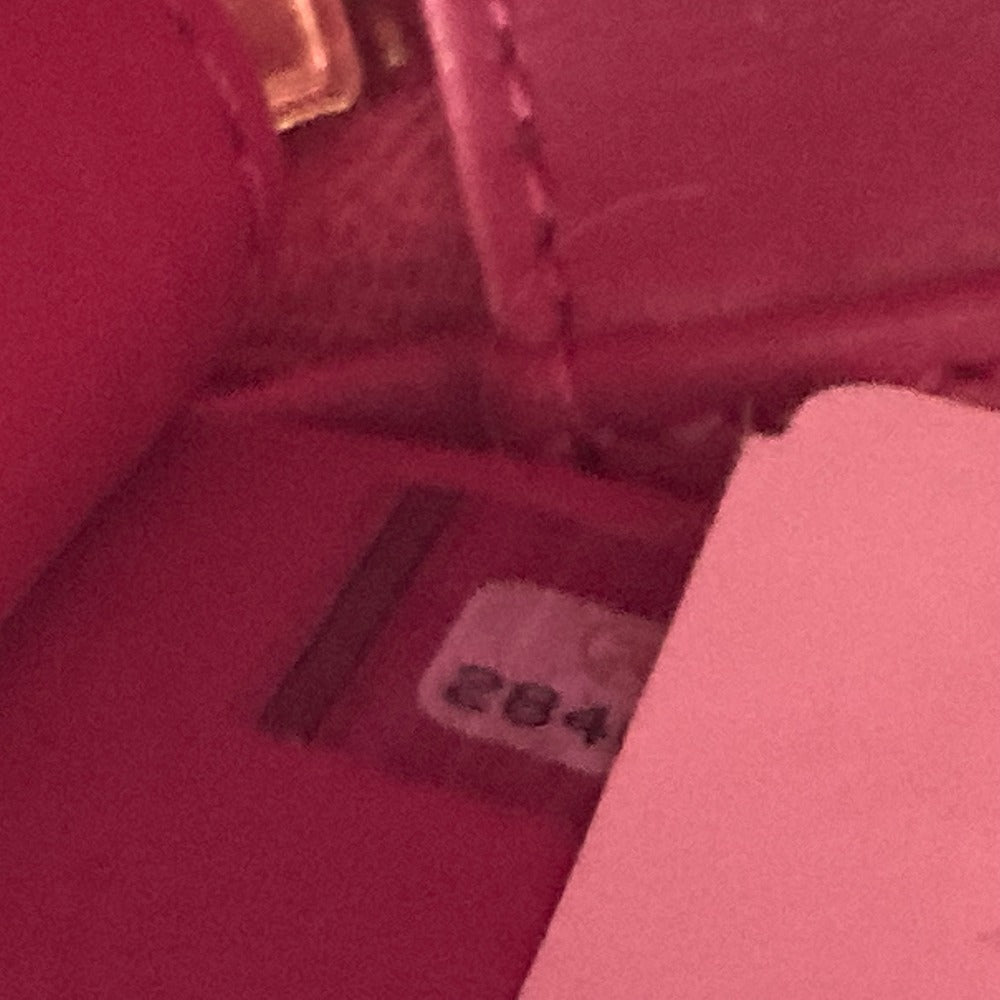 Close-up of a pink fabric with a label number 284 on a blurred background