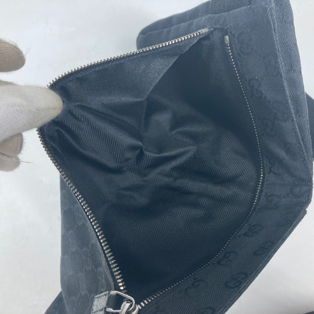Dark blue textured bag with a zipper on a white background