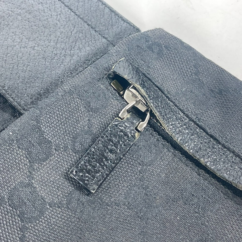 Close-up of a zipper on a gray fabric bag