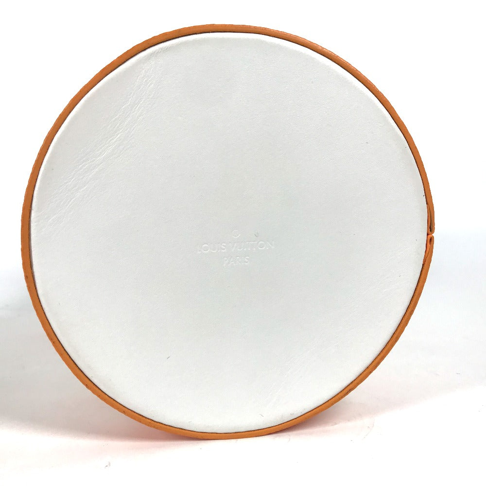Round white object with brown rim on a white background