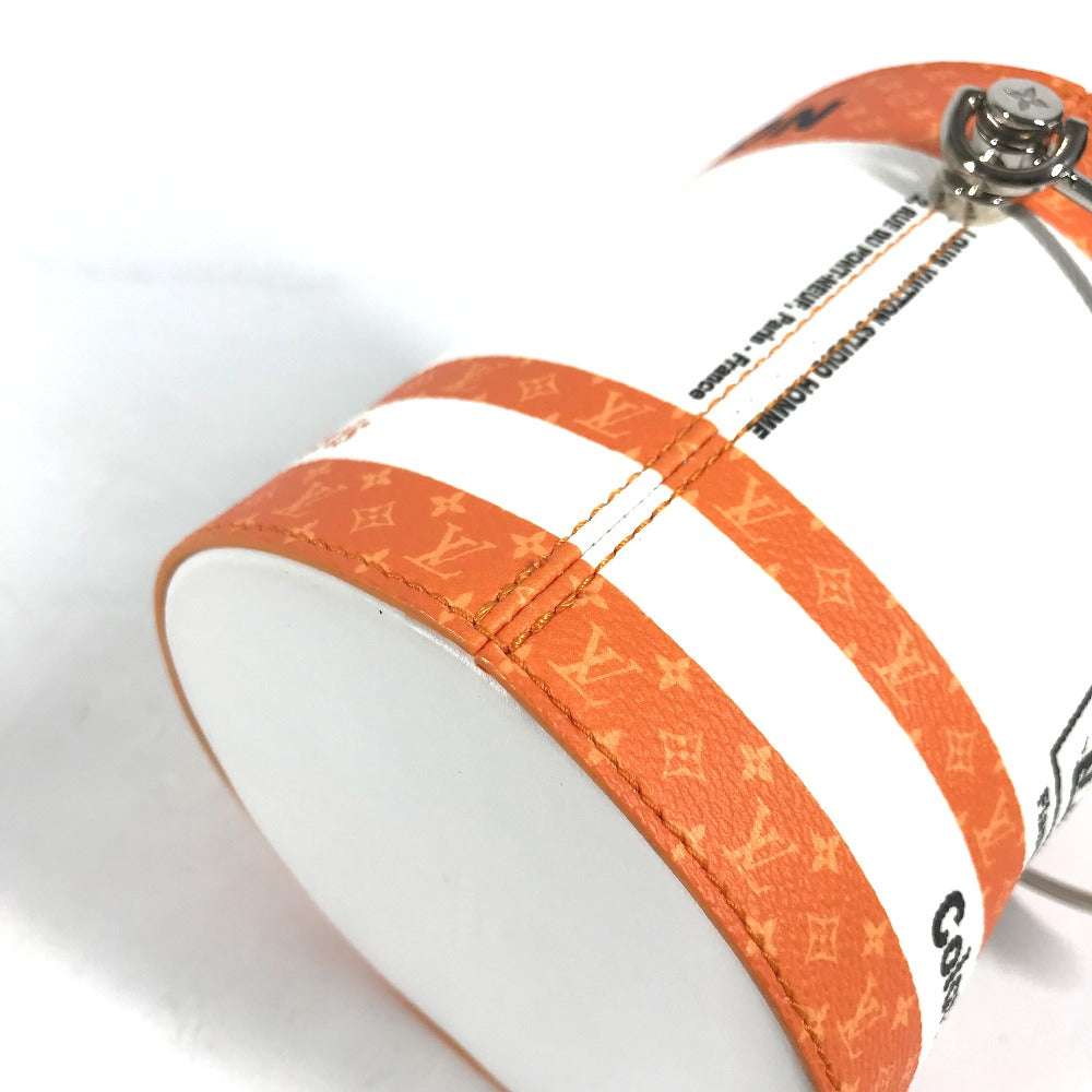 Close-up of an orange strap with a brand logo on a white background