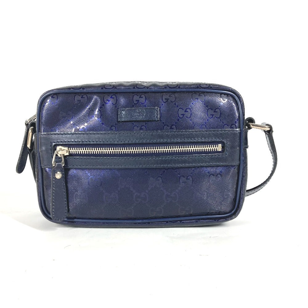 Blue handbag with a gold zipper on a white background