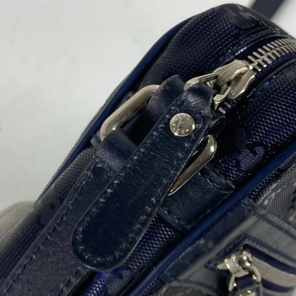 Close-up of a blue textured bag with a silver zipper on a white background