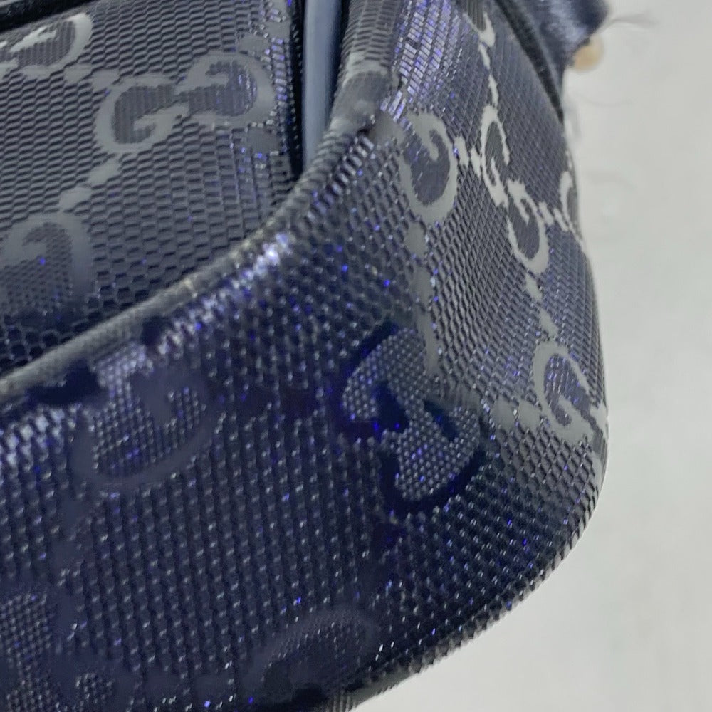 Close-up of a blue textured bag with a pattern on a white background