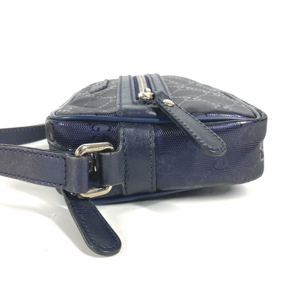 Navy blue handbag with monogram pattern on a white background