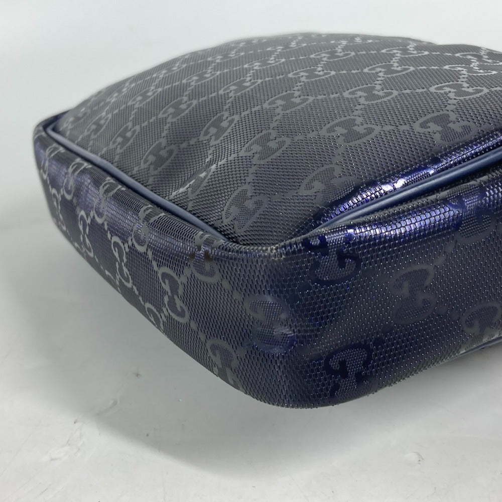 Blue patterned suitcase on a white background