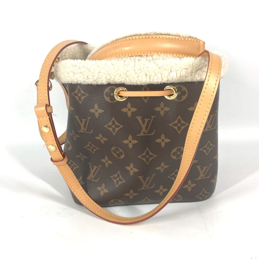 Designer handbag with monogram pattern on a white background