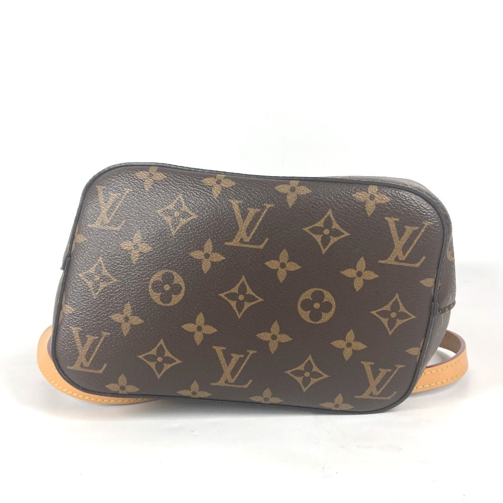Brown handbag with beige monogram pattern on a white background