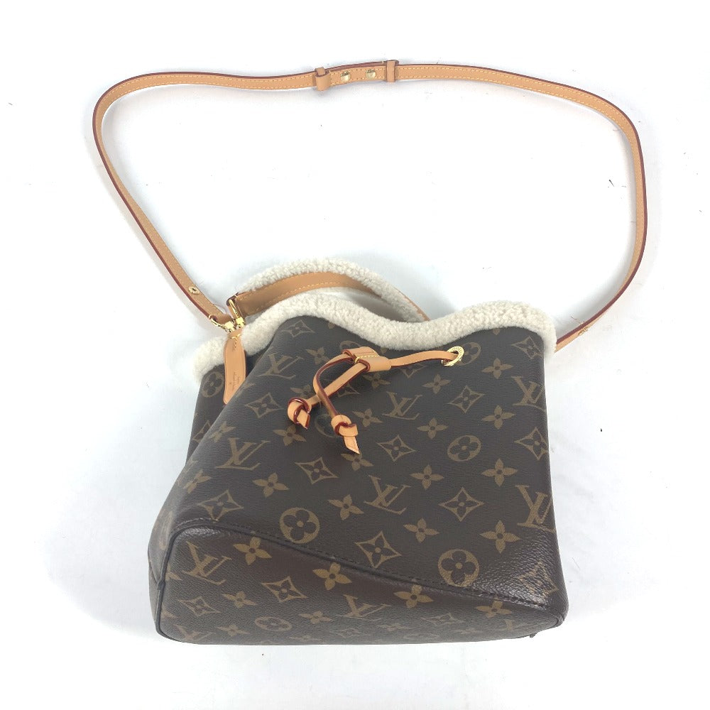 Designer handbag with monogram pattern on a white background