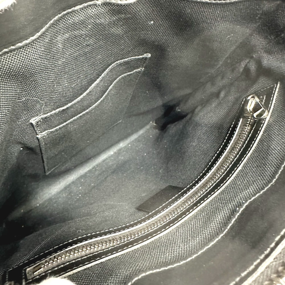 Close-up of a black bag with a zipper and pocket.