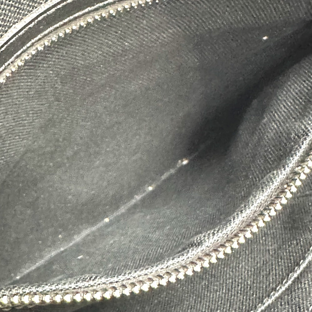 Close-up of a black fabric with a silver zipper