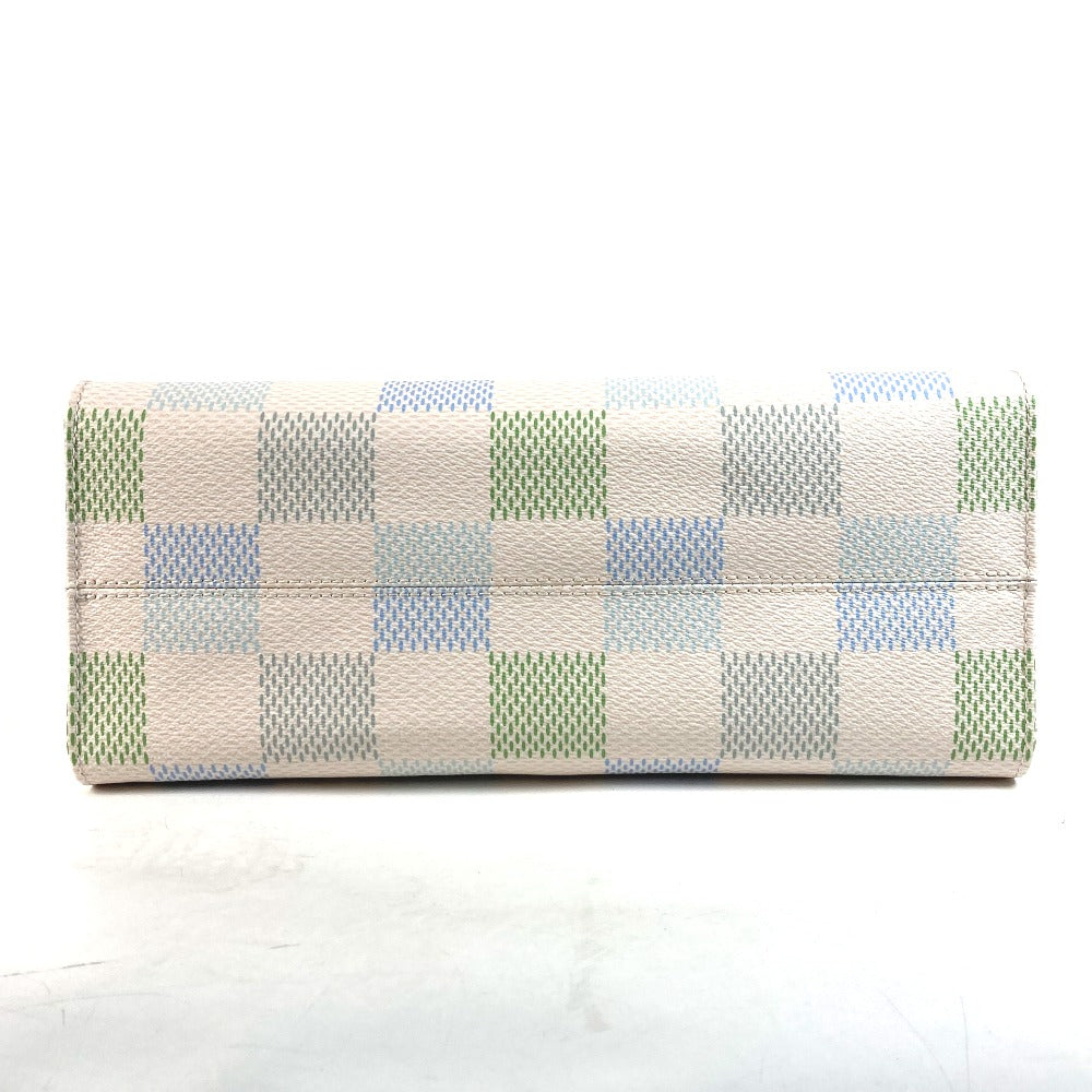 Checkered wallet with green and blue pattern on a white background