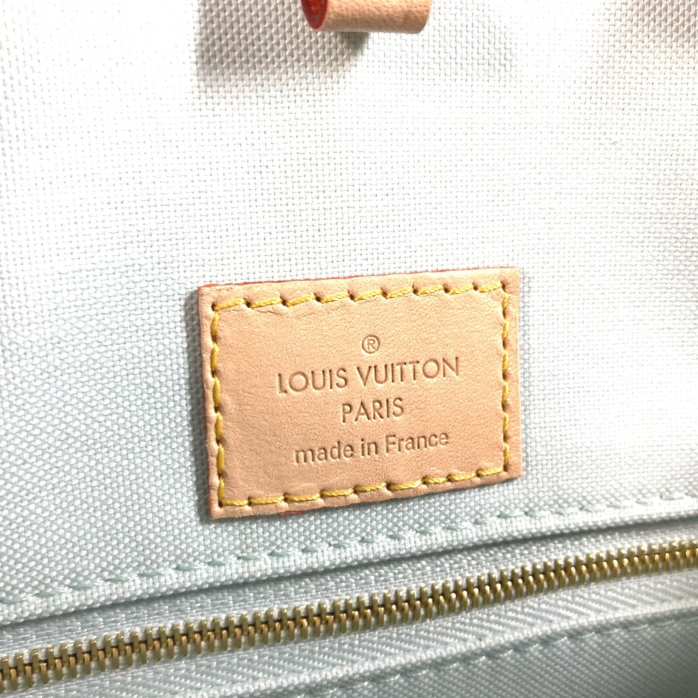 Louis Vuitton label on a light blue fabric background