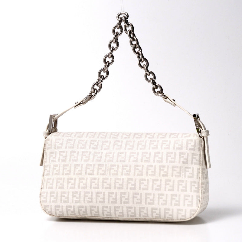 White handbag with chain strap on a white background