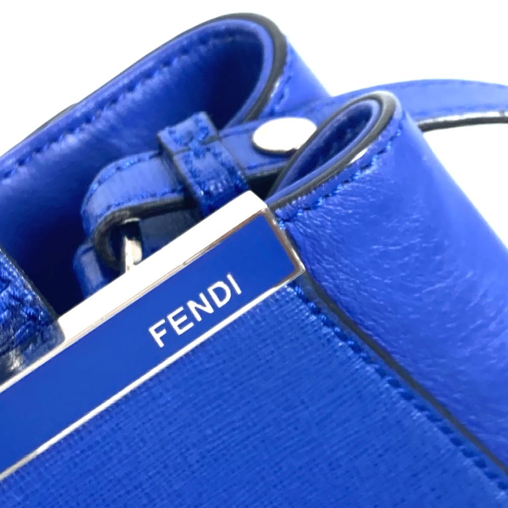 Close-up of a blue Fendi handbag with a visible brand logo.