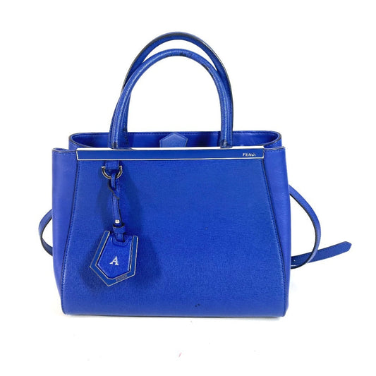 Blue handbag with a visible brand logo on a white background