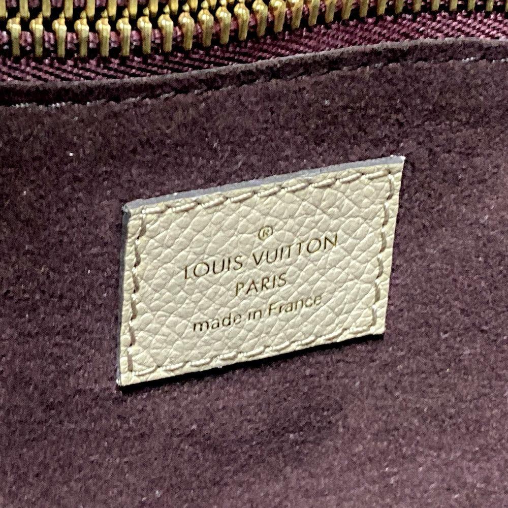 Louis Vuitton label on a purple fabric background