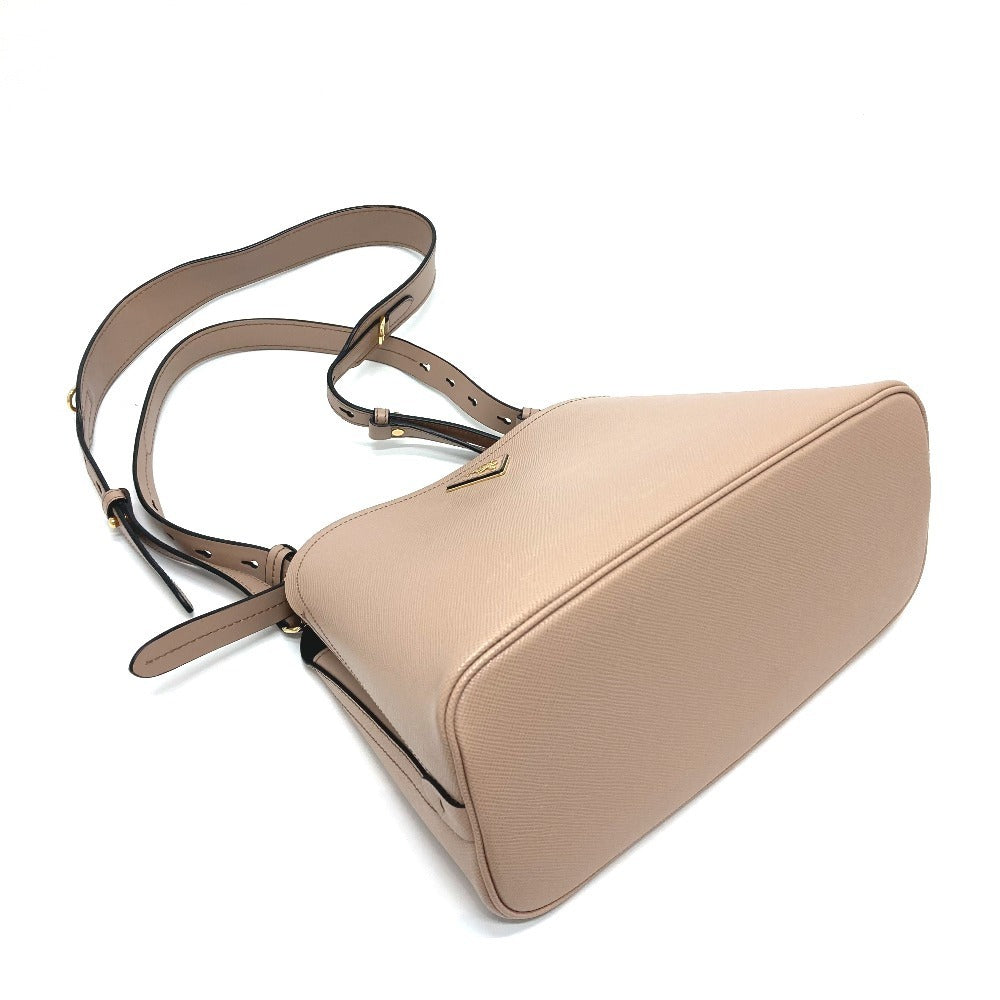 Beige handbag with a strap on a white background