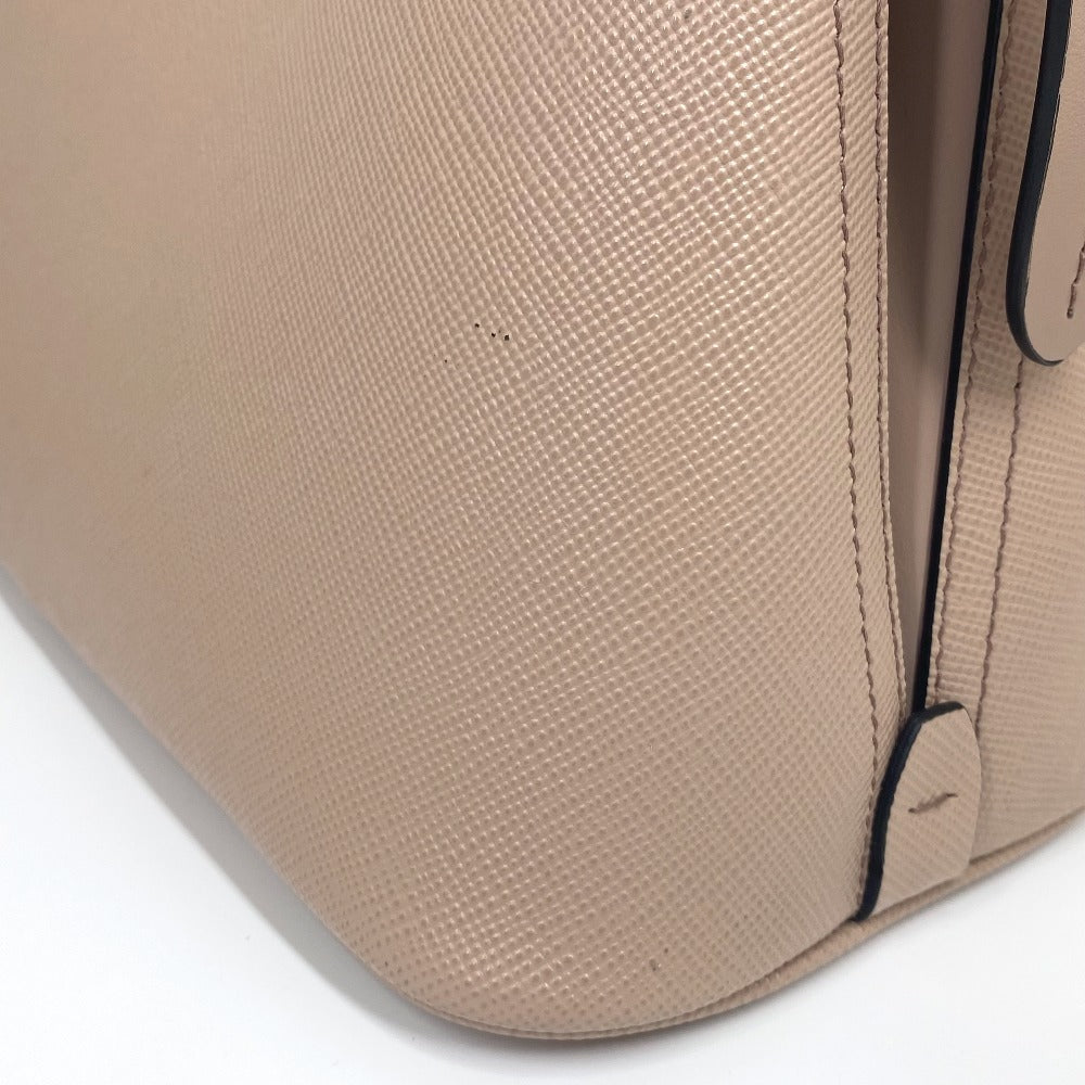 Close-up of a beige textured bag with a black accent on a white background