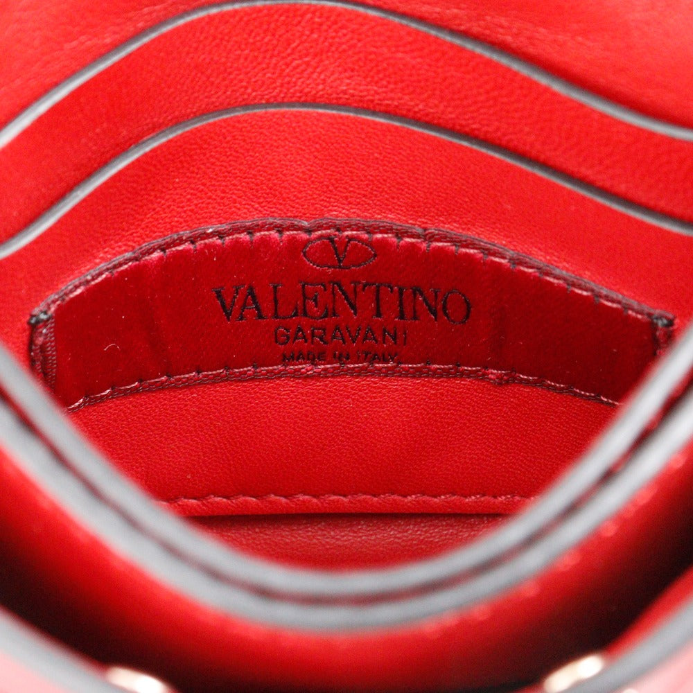 Close-up of a red leather interior with 'Valentino' branding.