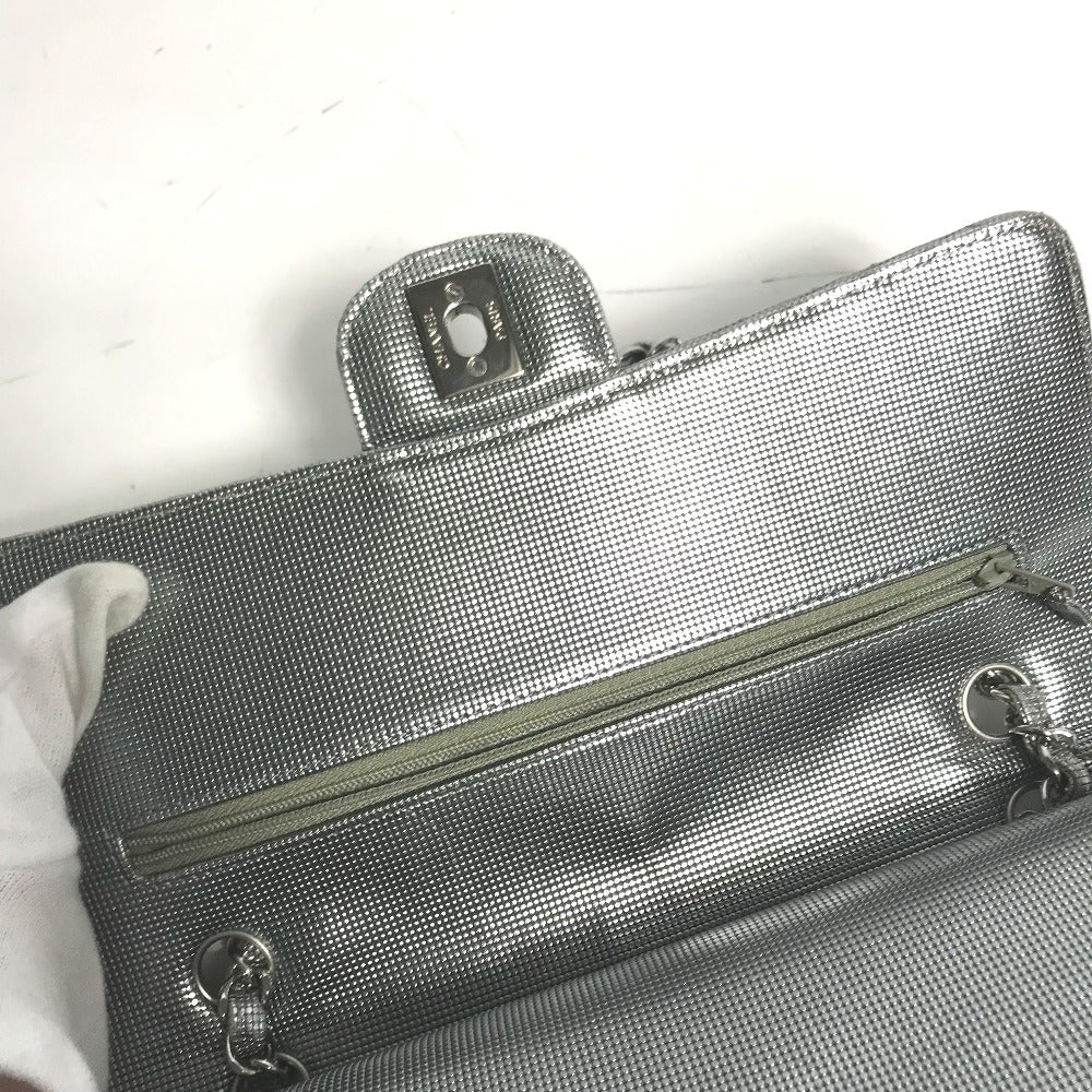 Silver clutch bag with a visible brand logo on a white background